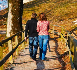 couple walking on a bridge