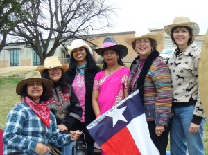 posiitive force, mina khan, a group of women in cowboy hats with texas flag