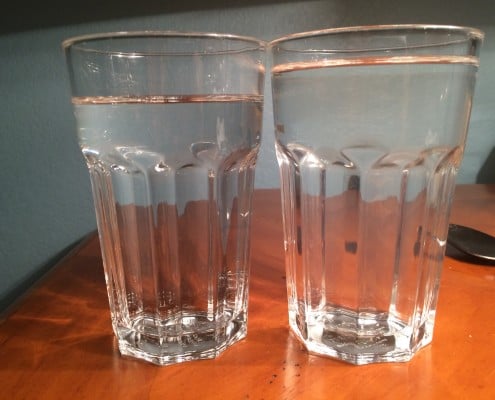 two cups of water on a table