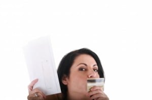 woman kissing credit card