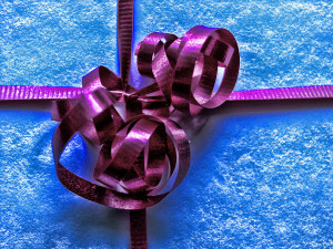 Blue gift with purple ribbon