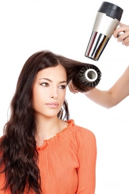 woman getting her hair blow dryed
