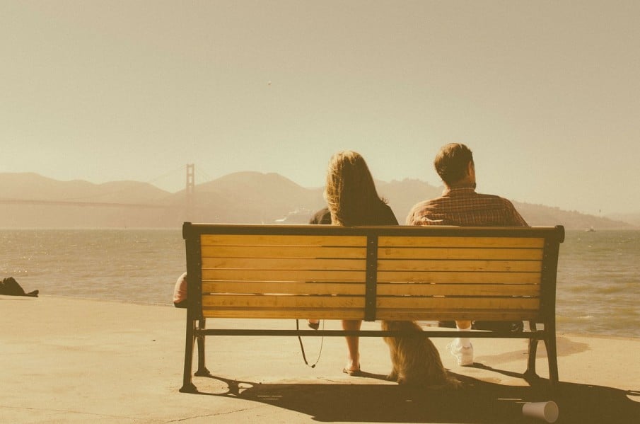 couple in a relationship on a bench