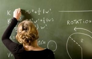 women doing math problems to earn math degrees