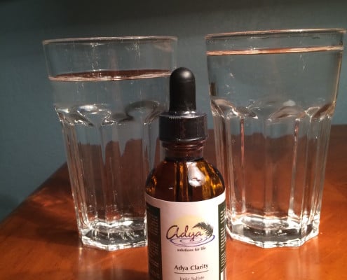adya clarity bottle and two glasses of water