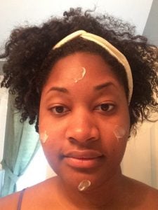 Woman using anti-wrinkle skin cream