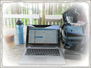 computer water bottle and starbucks on desk