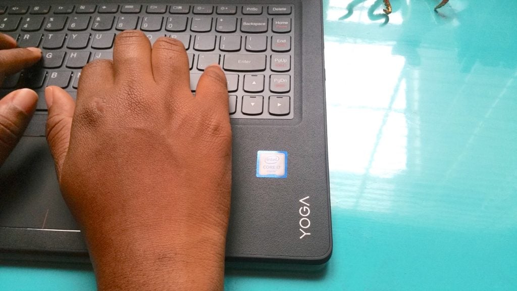hands typing on a Lenovo yoga Intel 2in1