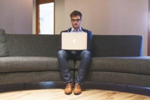 man with laptop Sitting alone will not get you promoted