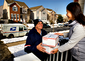 usps man delivering a package for the holidays