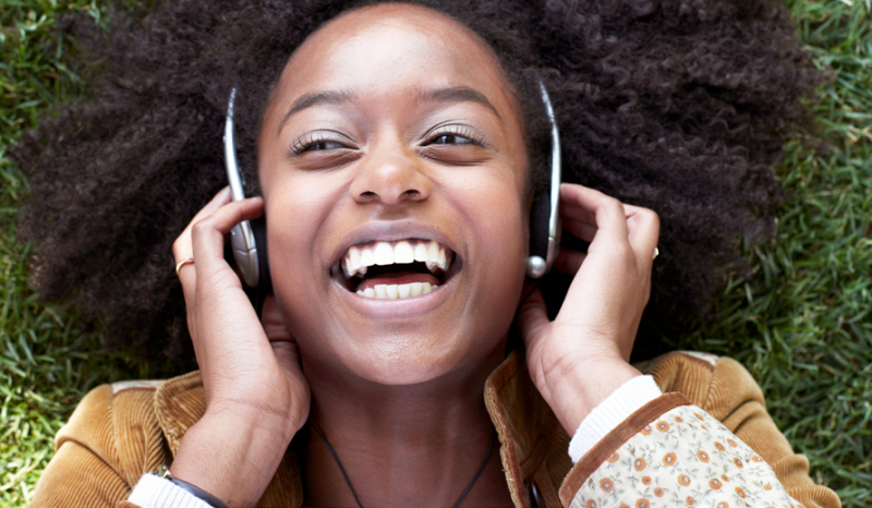 woman listening to music on a road trip