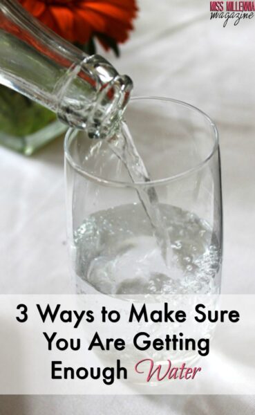 a glass of water being poured into a glass