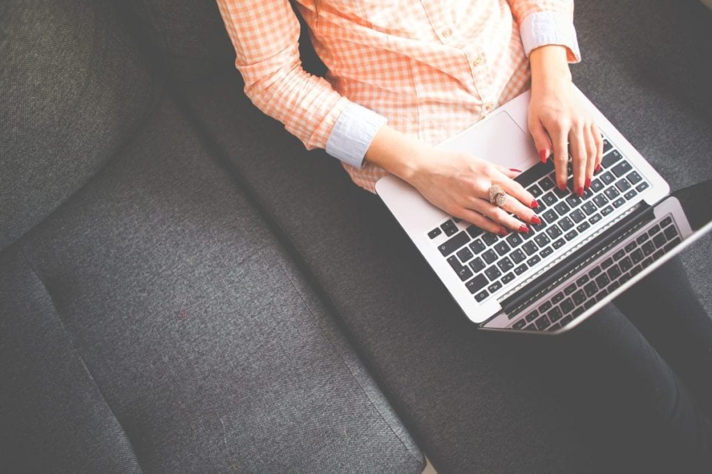 woman working on laptop on stella & dot independent stylist