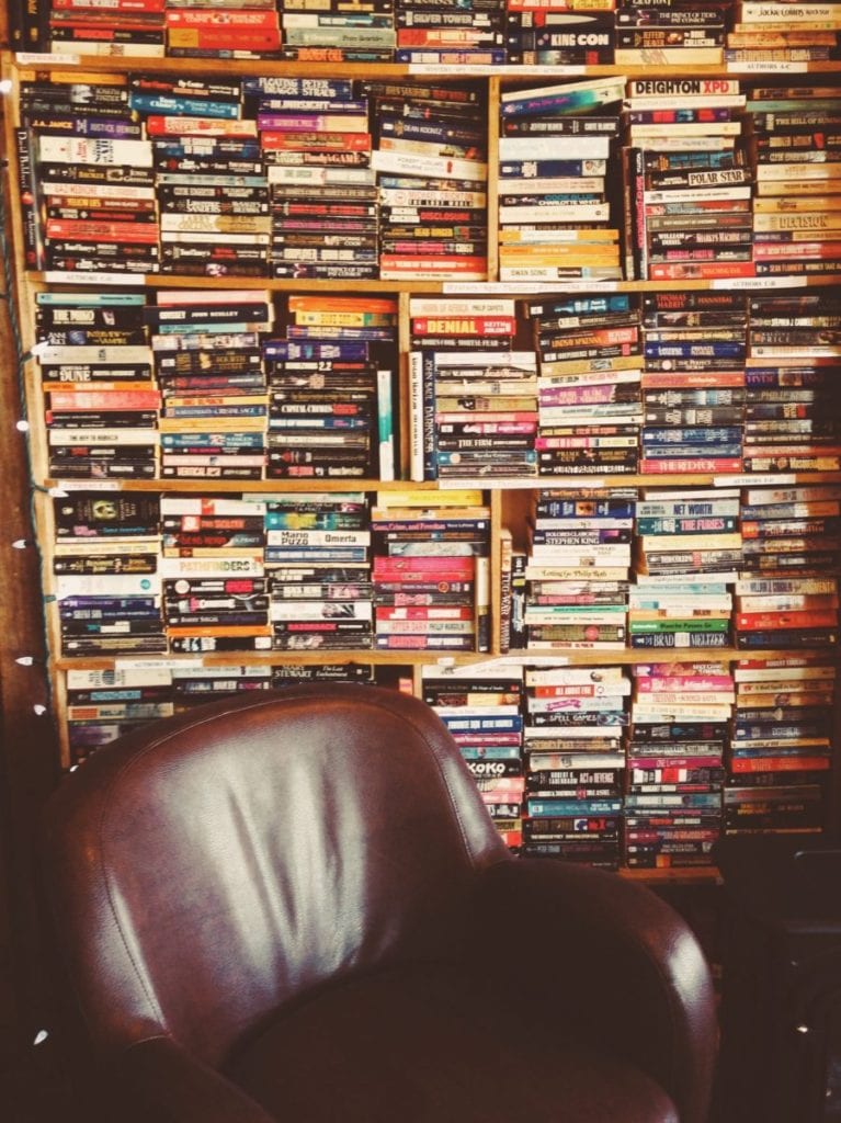bookshelf and armchair