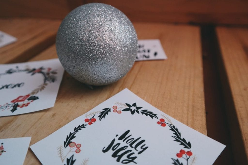 holiday cards and silver glitter ball