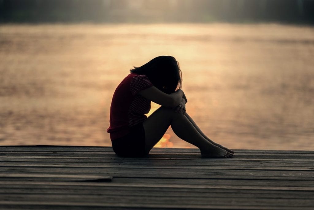 girl crying on dock