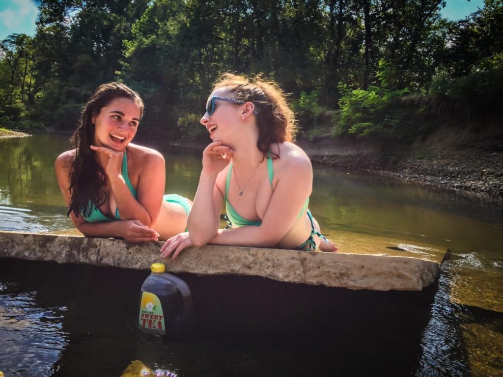 two women in river with body confidence miss millennia magazine
