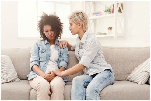 woman comforting friend : high-functioning anxiety