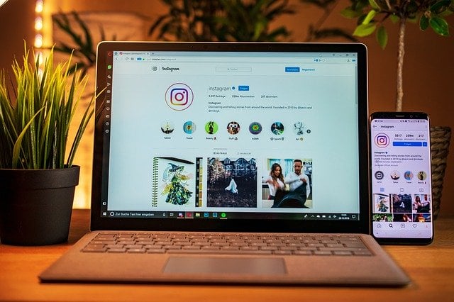 laptop on table with instagram open