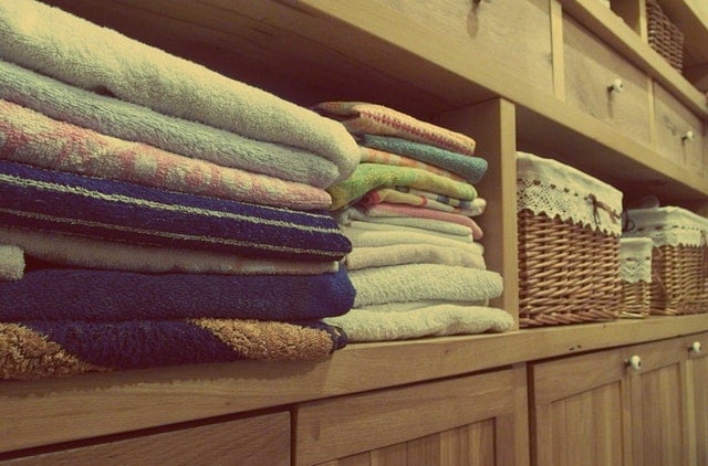 closet filled with towels and baskets