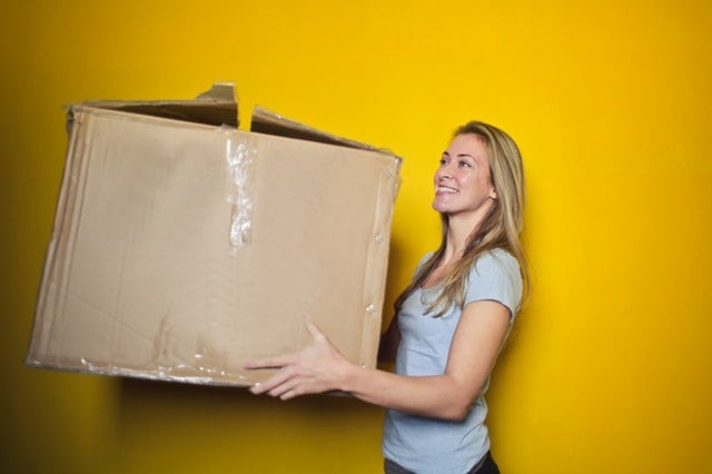 woman holding an old box