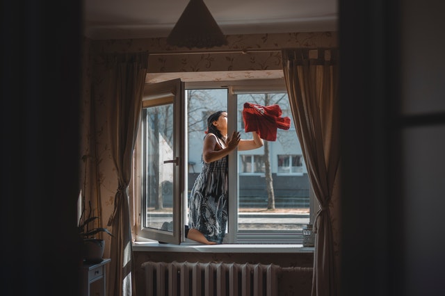 woman cleaning windows