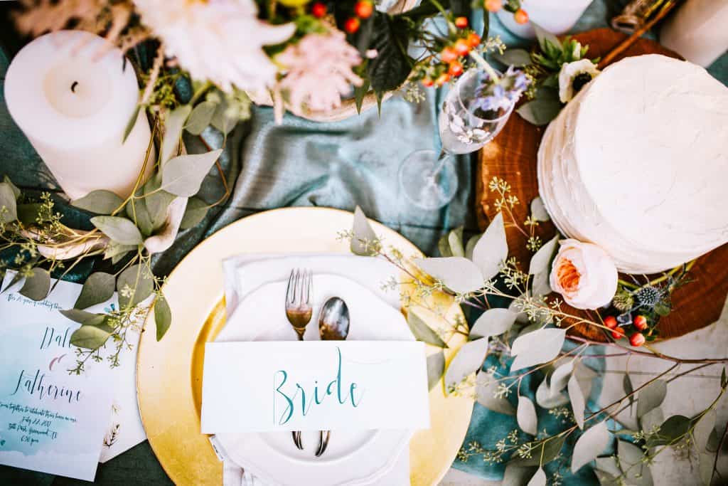 Artificial flowers decorating a place setting for a bride. 