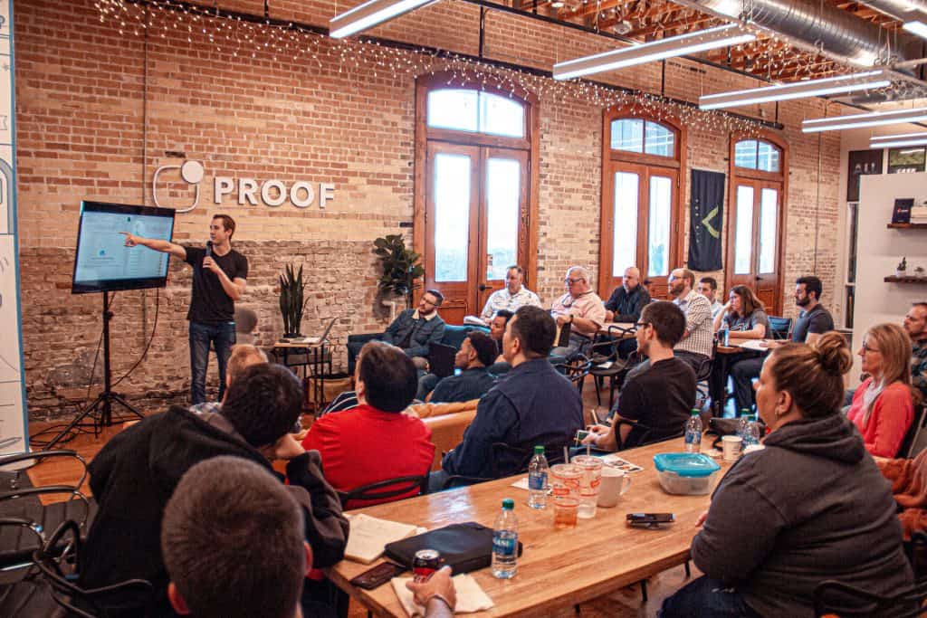 A person speaking to a large group of people