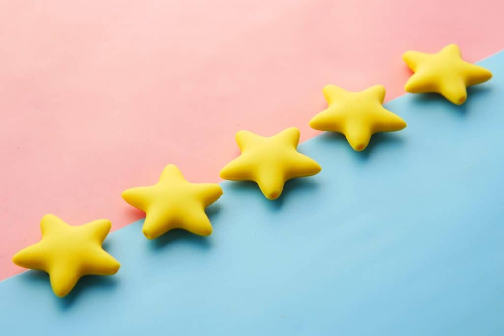 A line of stars on a pink and blue background