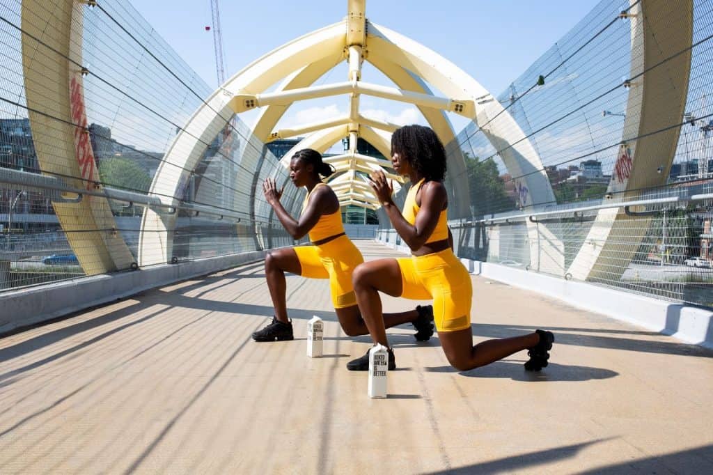 2 women exercising on a bridge. They decided to choose diet direct.