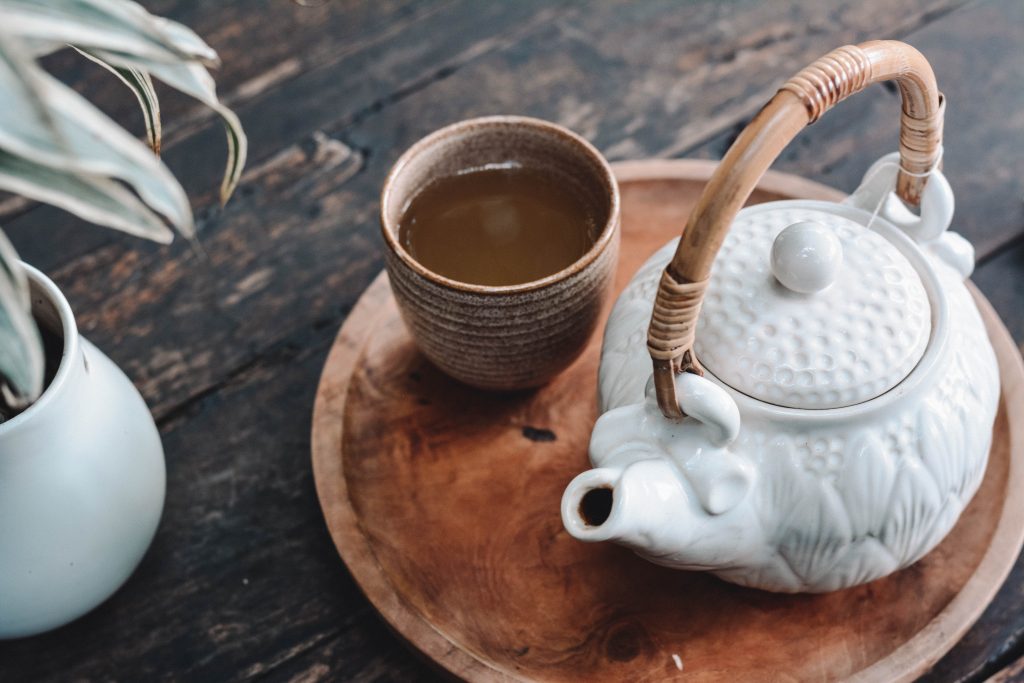 A wood and porcelain tea set 