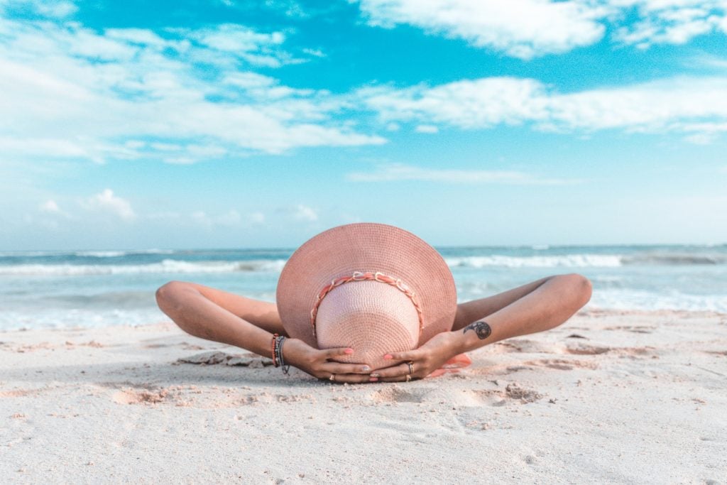 Woman sunbathing on a beach 