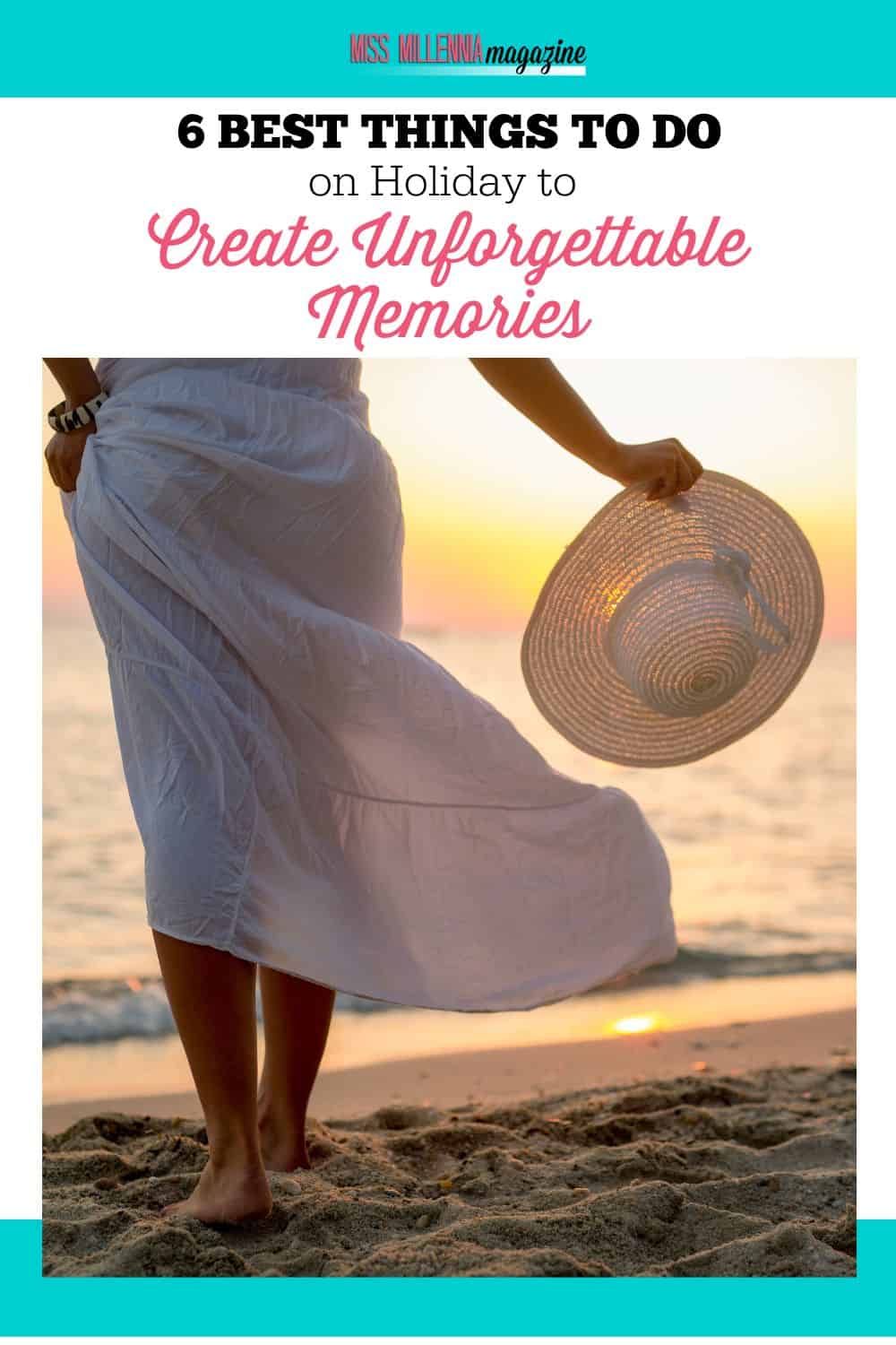 a person in a white dress holding a hat on a beach